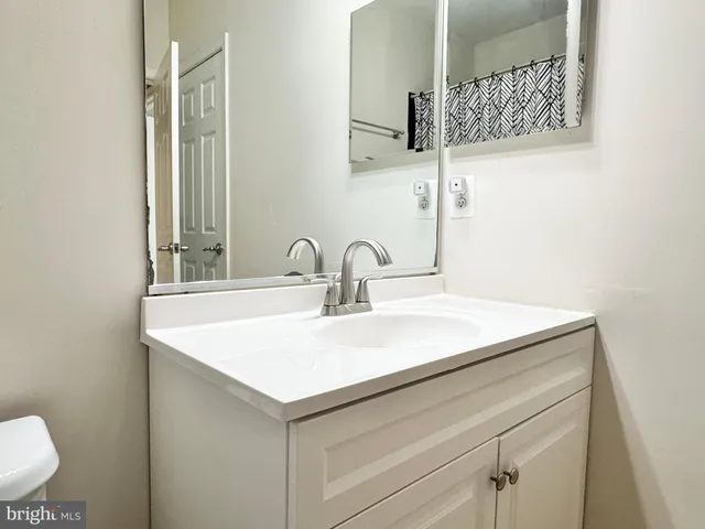 a close view of sink and mirror in bathroom