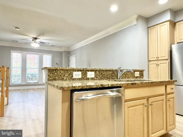 a kitchen with stainless steel appliances granite countertop a stove and a sink