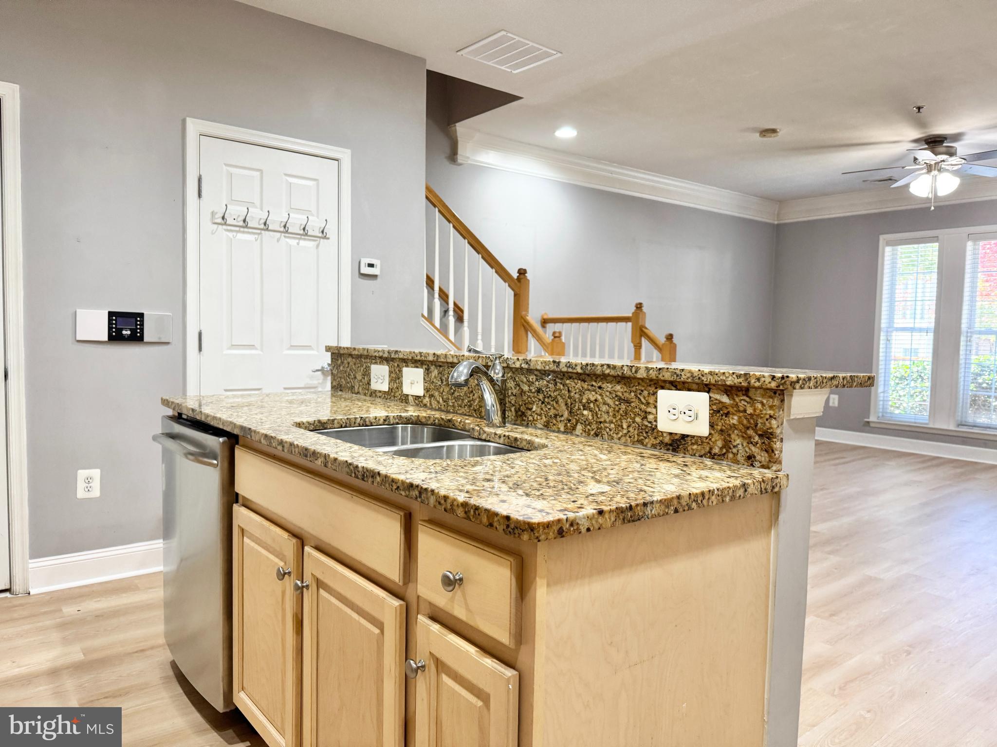 2396 Brookmoor Lane, Unit 401A Woodbridge, VA 22191 - Photo 10 of 26 a bathroom with a granite countertop sink and a mirror