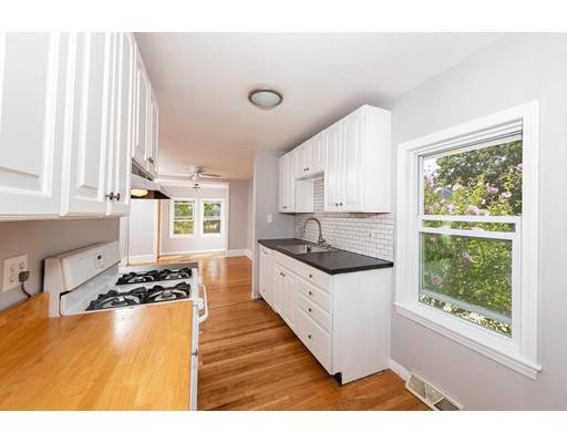 19 Pine Ridge Road Weymouth, MA 02189 - Photo 3 of 15 a kitchen with stainless steel appliances granite countertop a sink stove and white cabinets