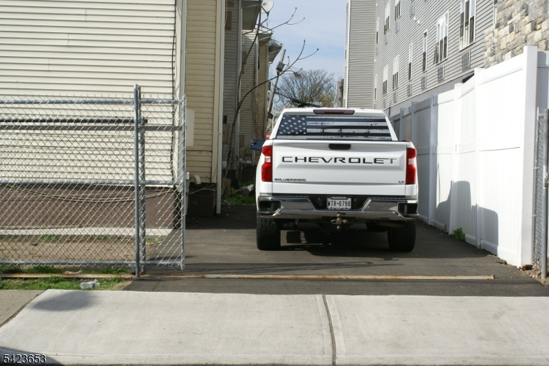233 Straight Street, Unit 2 Paterson, NJ 07501 - Photo 9 of 9 a sign on a pole on a street