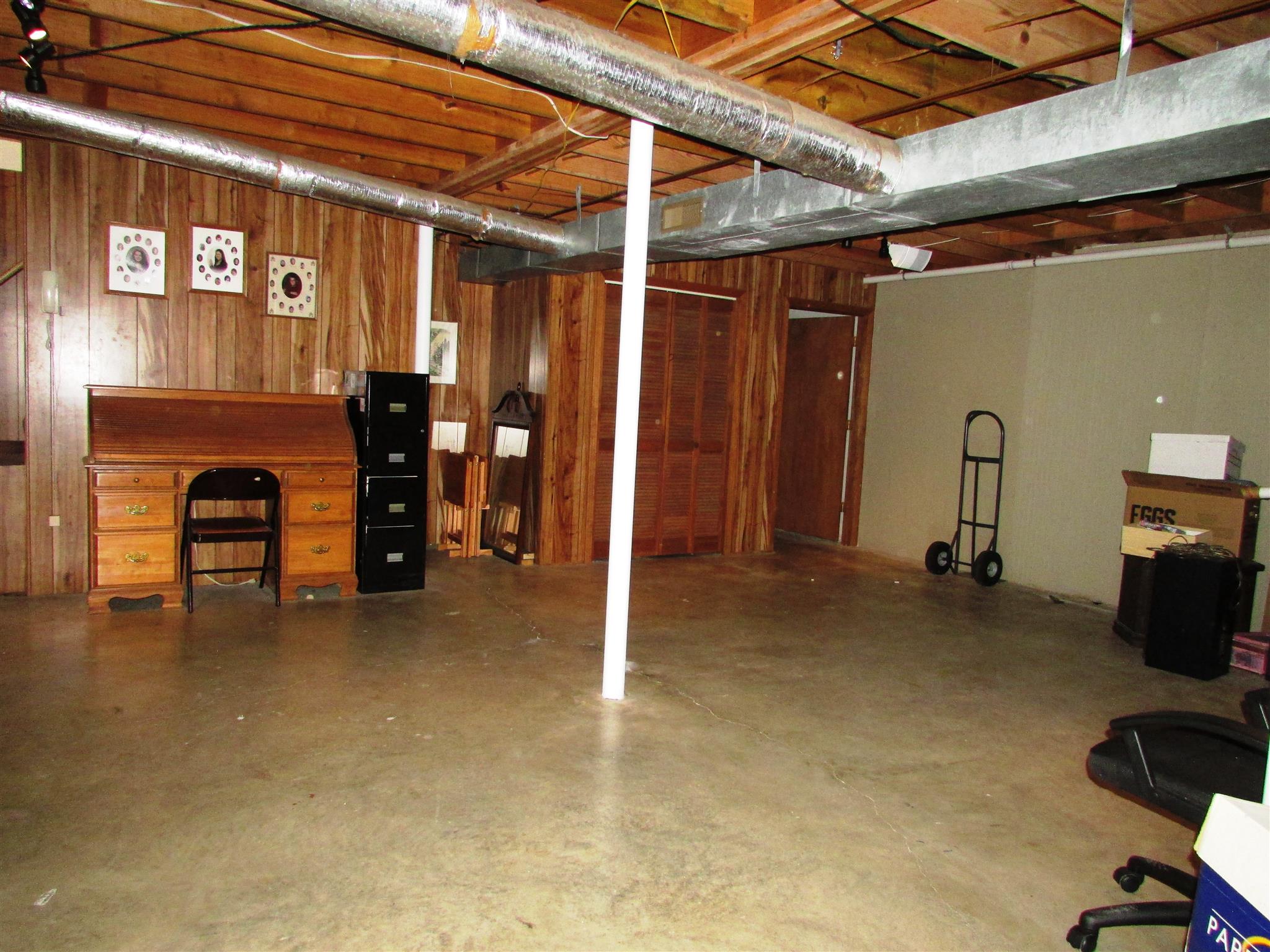 745 New Hope Road Alexandria, TN 37012 - Photo 17 of 30 Downstairs to the basement with tall ceilings and already has central Heat & Air