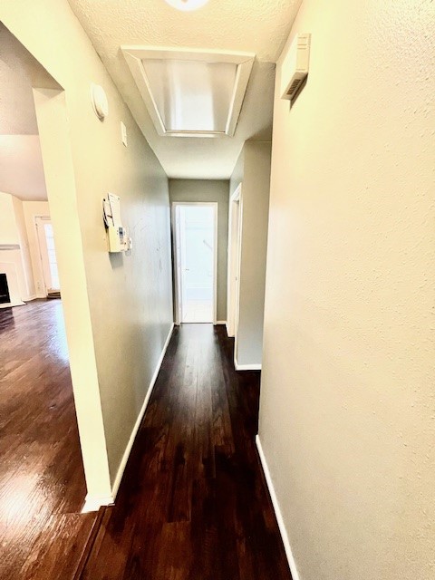 28703 Loddington Street Spring, TX 77386 - Photo 13 of 16 a view of a hallway with wooden floor and staircase