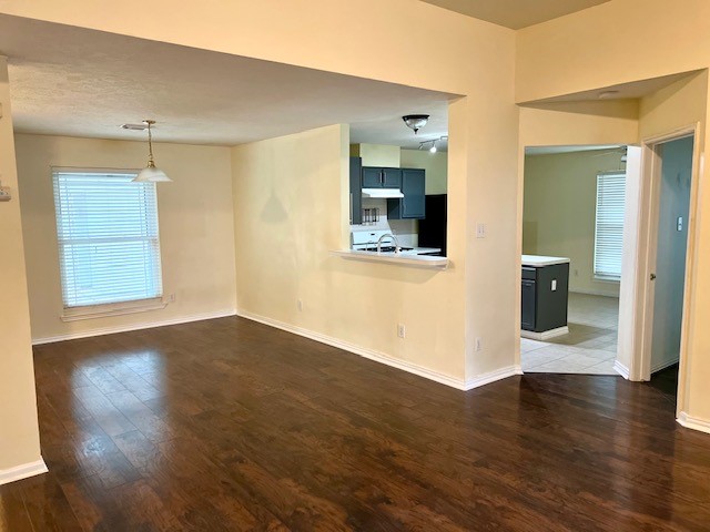 28703 Loddington Street Spring, TX 77386 - Photo 7 of 16 a view of an empty room with wooden floor and a window