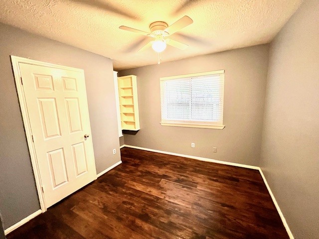 28703 Loddington Street Spring, TX 77386 - Photo 9 of 16 a view of an empty room with wooden floor and a window