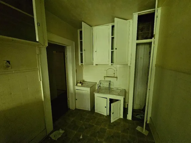 a view of a livingroom with furniture and stairs