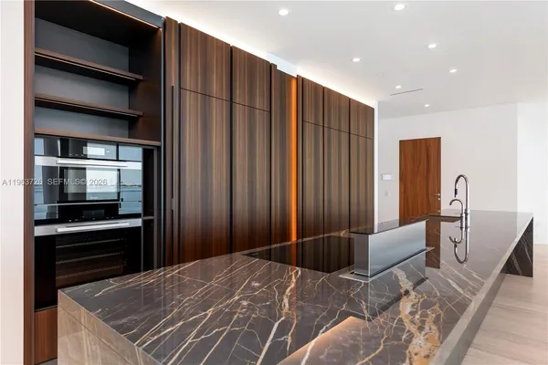 a bedroom with a bed and a television