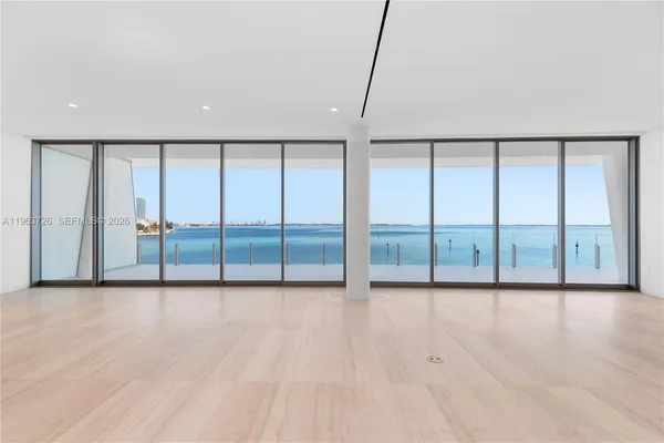 a view of an empty room with a balcony