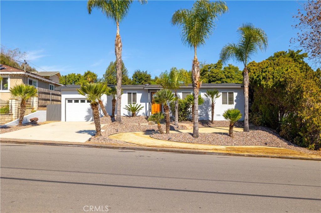 209 Almond Street Fallbrook, CA 92028 - Photo 1 of 1 a view of a house with small yard and palm trees