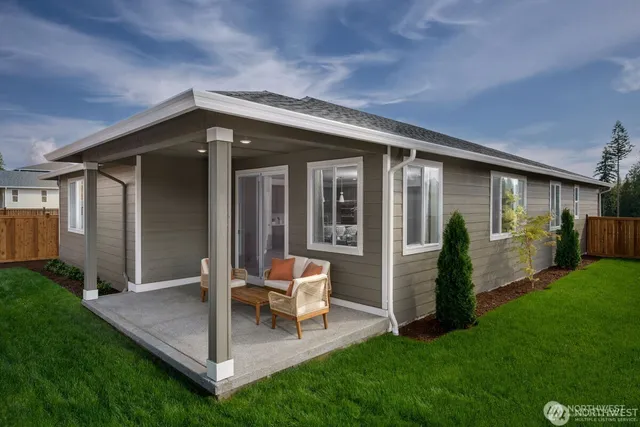 a view of an house with backyard porch and furniture