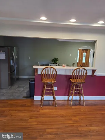 a view of front door with table and chairs