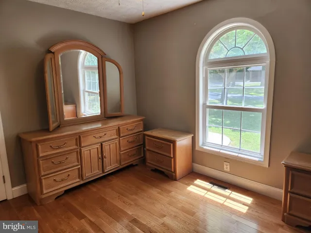 a view of a livingroom with furniture and window