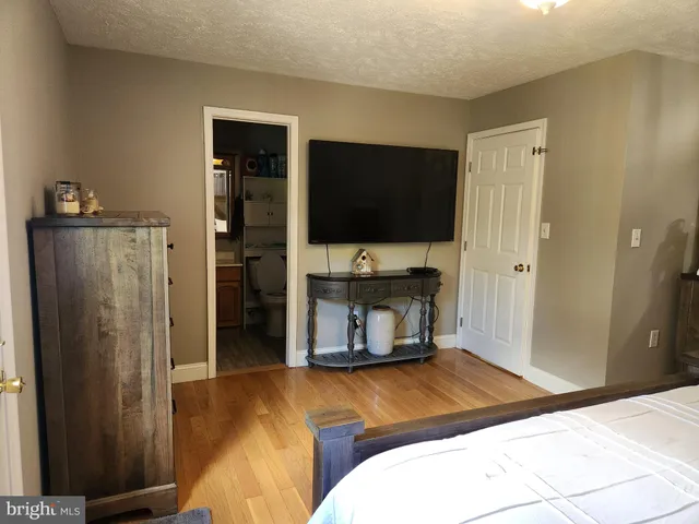 a living room with a flat screen tv and a fireplace