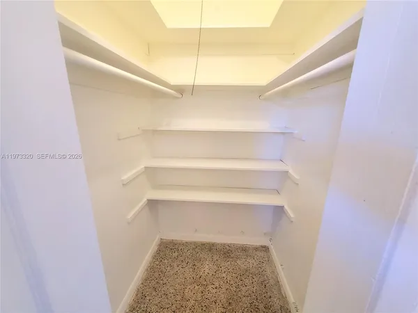 a view of staircase with white walls