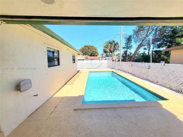 a house view with a backyard space