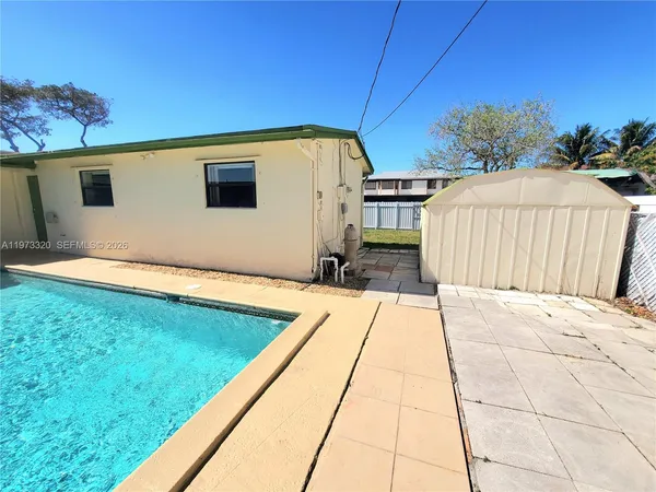 a view of a house with a yard and garage