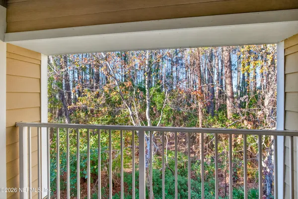 a bathroom with a toilet a sink and a mirror