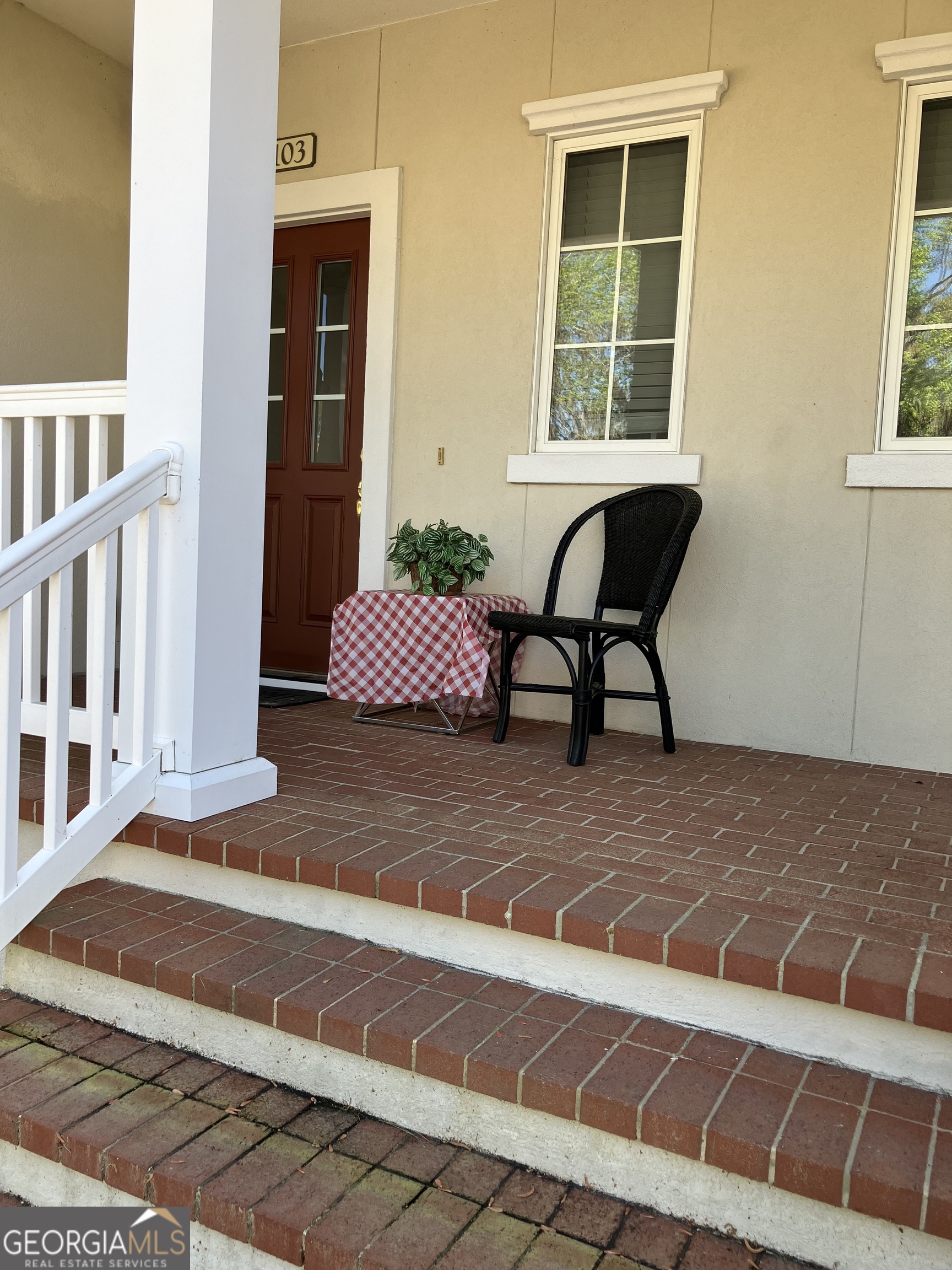 a view of a lounge chairs in front of a house