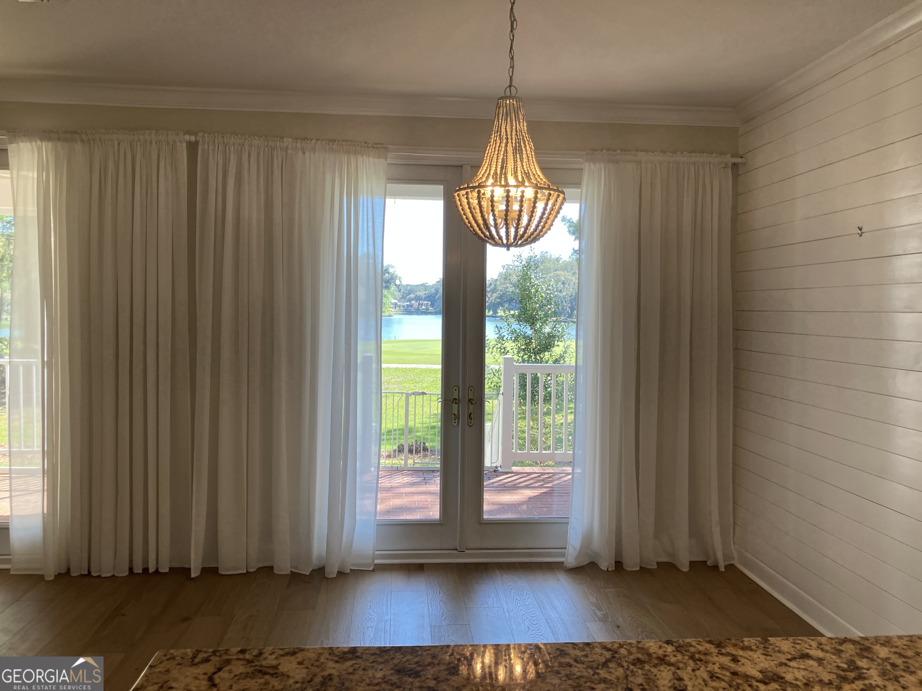 103 Kiln Trail St. Simons Island, GA 31522 - Photo 27 of 81 a view of empty room with wooden floor and fan