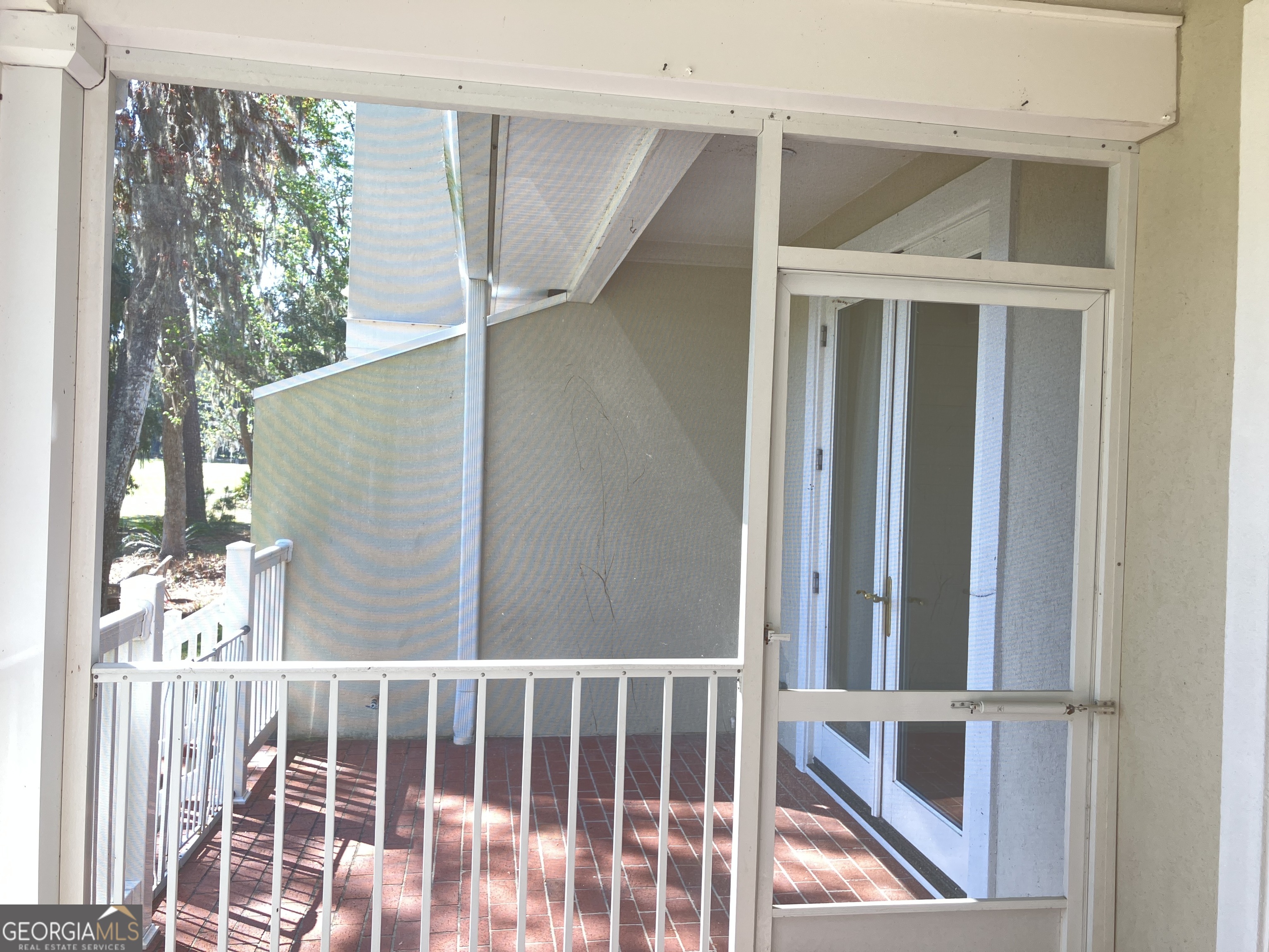 103 Kiln Trail St. Simons Island, GA 31522 - Photo 32 of 81 a view of balcony with wooden floor and wall