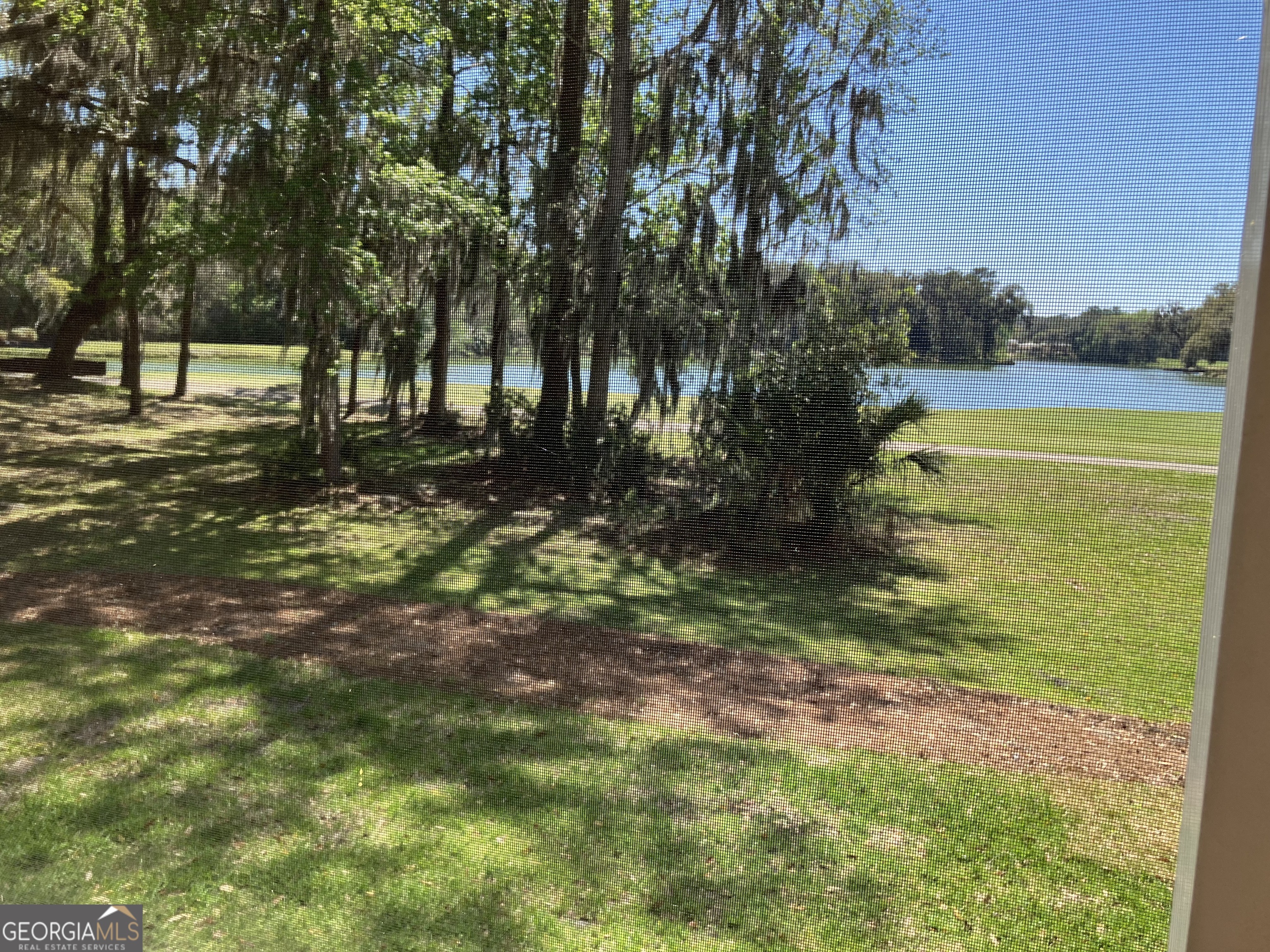 103 Kiln Trail St. Simons Island, GA 31522 - Photo 35 of 81 a view of a yard with trees