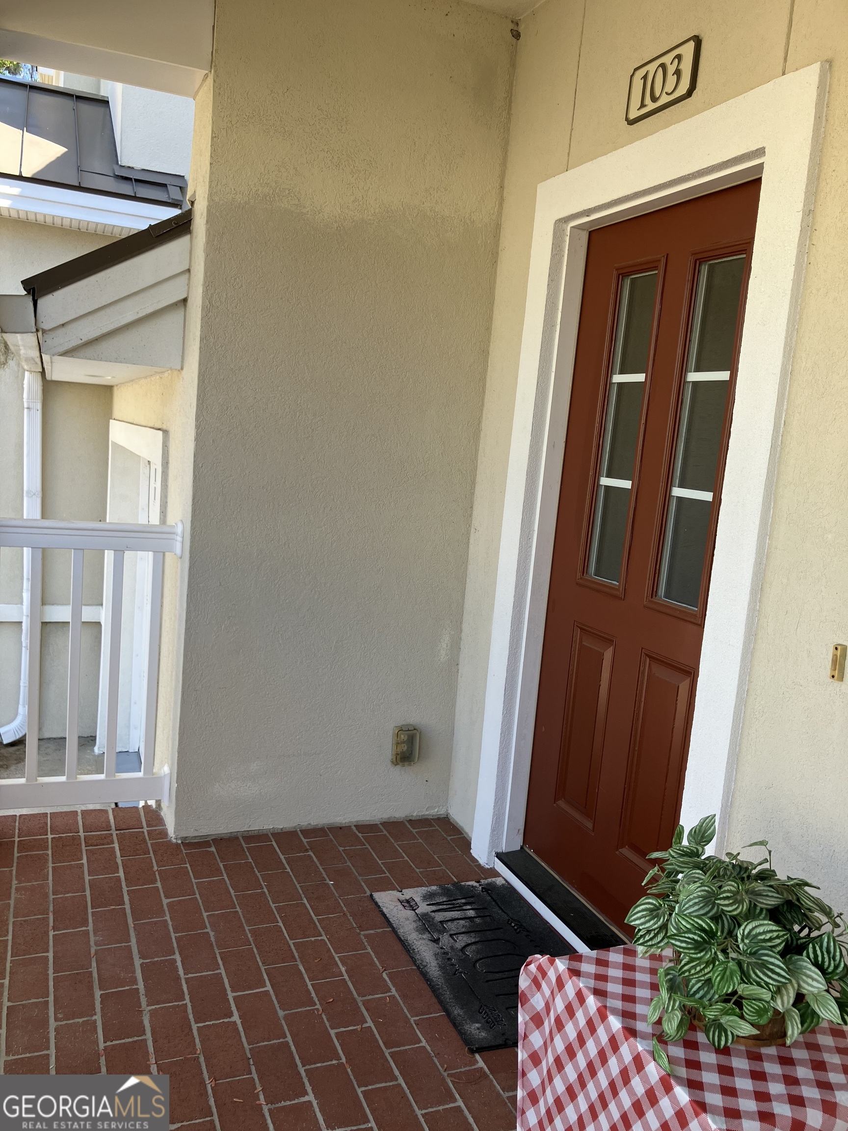 103 Kiln Trail St. Simons Island, GA 31522 - Photo 6 of 81 a view of a door and a potted plant