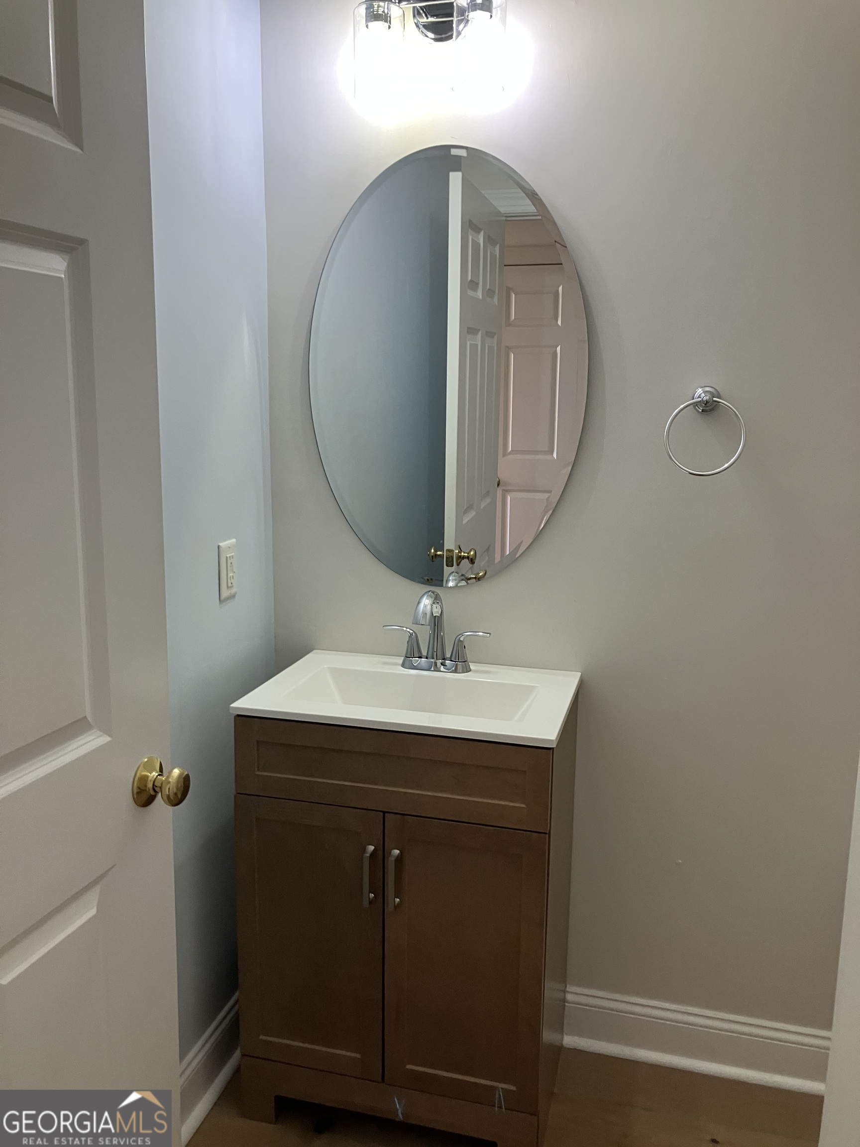 103 Kiln Trail St. Simons Island, GA 31522 - Photo 9 of 81 a bathroom with a sink and a mirror