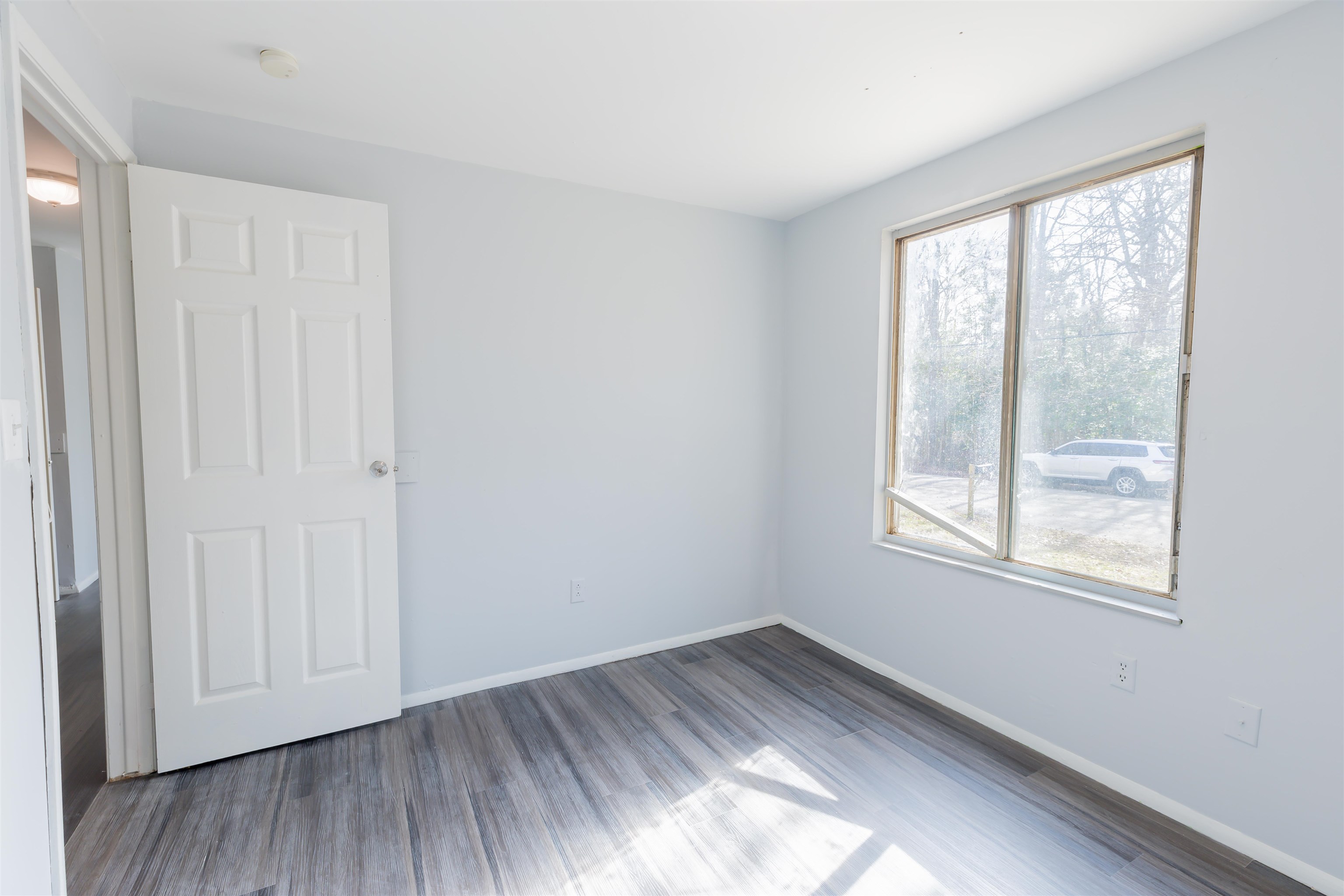 900 East Main Street Rio Grande, NJ 08242 - Photo 19 of 29 an empty room with wooden floor and windows