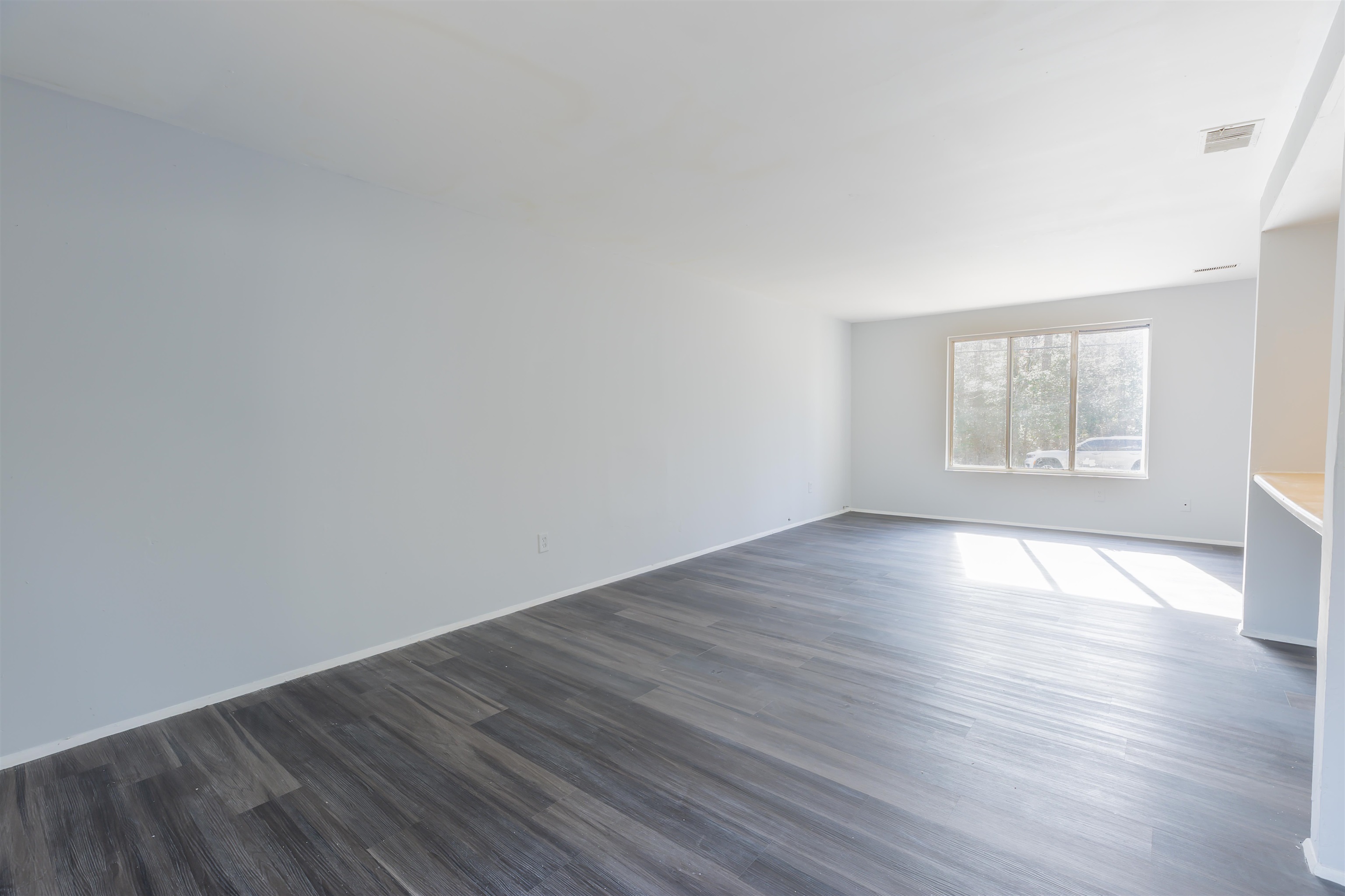 900 East Main Street Rio Grande, NJ 08242 - Photo 7 of 29 an empty room with wooden floor and windows