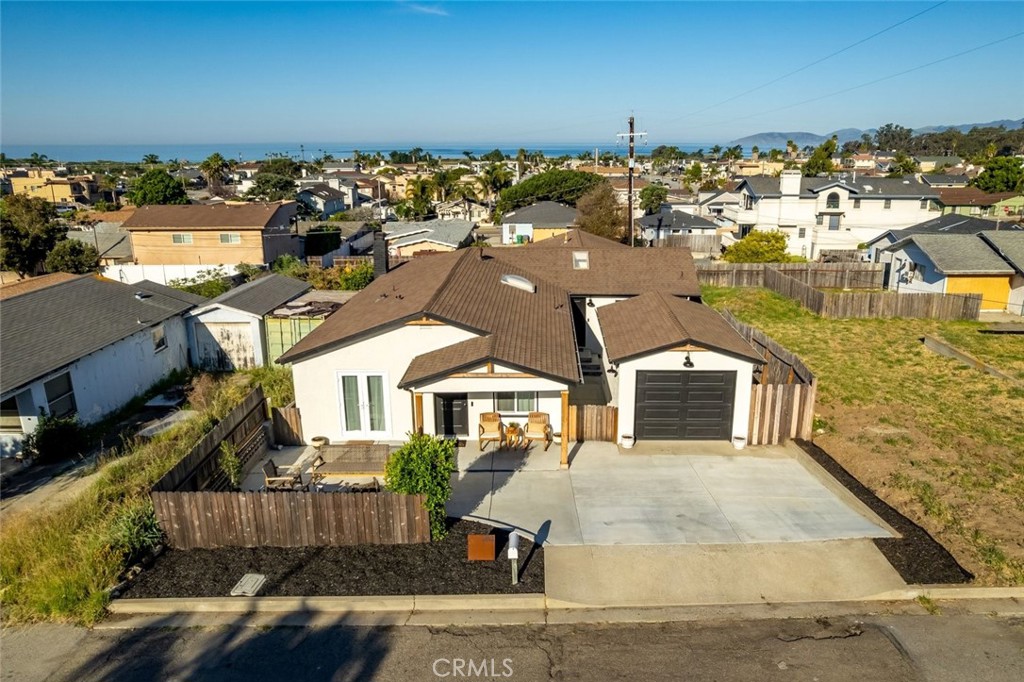 an aerial view of a house with parking space