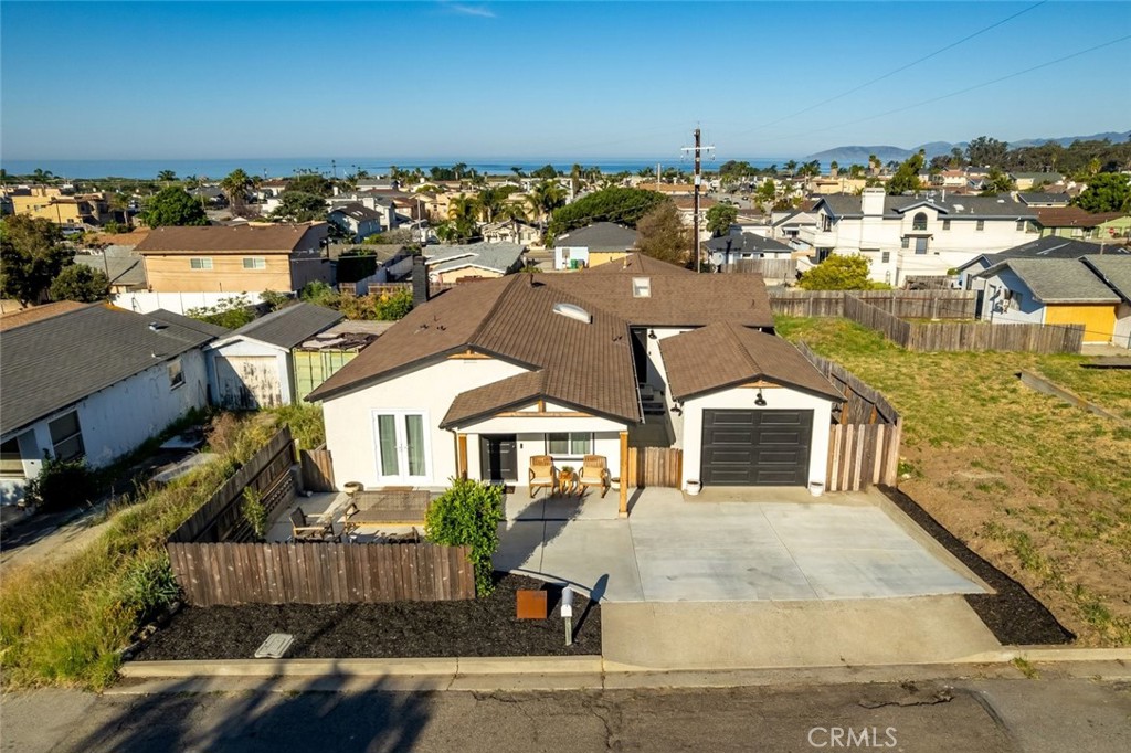 363 North 5th Street Grover Beach, CA 93433 - Photo 1 of 54 an aerial view of a house with parking space