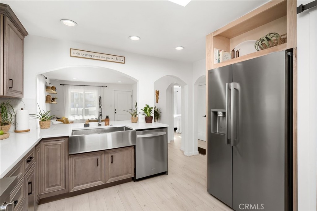 363 North 5th Street Grover Beach, CA 93433 - Photo 11 of 54 a kitchen with stainless steel appliances a refrigerator sink and stove