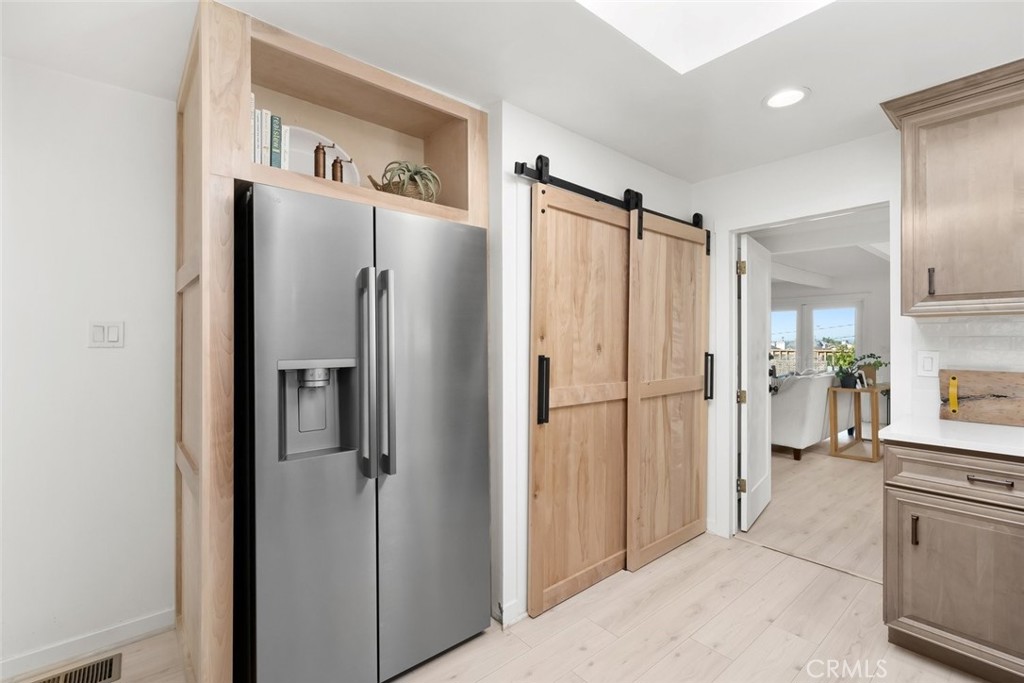 363 North 5th Street Grover Beach, CA 93433 - Photo 12 of 54 a view of a kitchen with a refrigerator