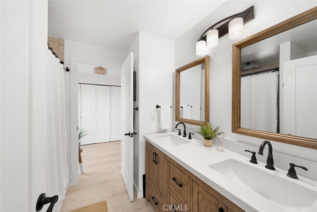 363 North 5th Street Grover Beach, CA 93433 - Photo 25 of 54 a bathroom with 2 sink and a mirror
