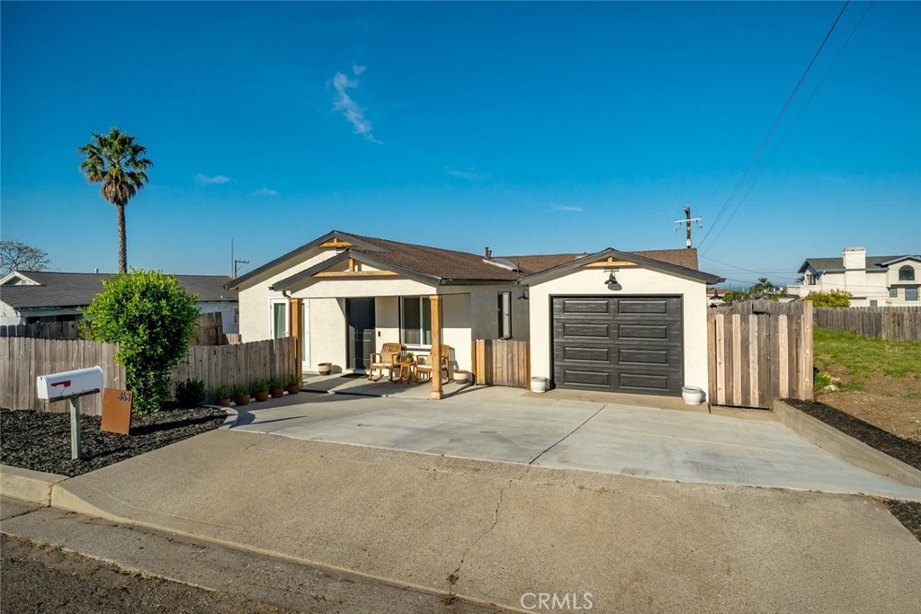 363 North 5th Street Grover Beach, CA 93433 - Photo 3 of 54 a view of a house with a garage