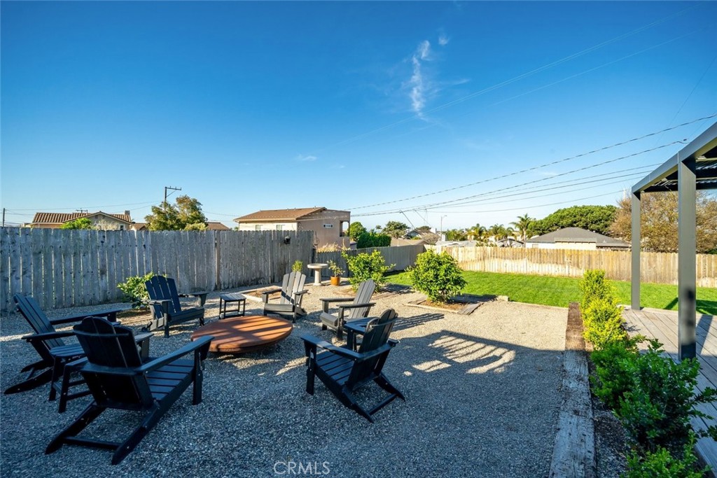 363 North 5th Street Grover Beach, CA 93433 - Photo 40 of 54 a view of a patio with couches table and chairs and potted plants
