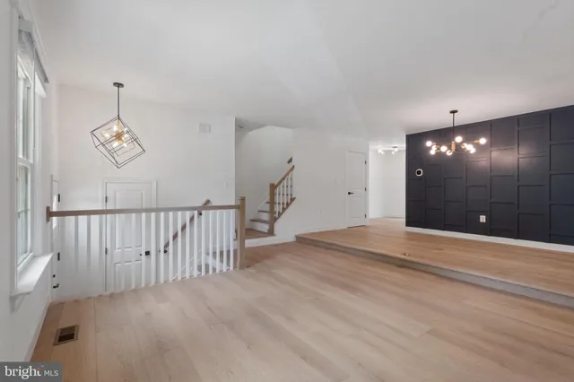 a view of a hallway with a chandelier