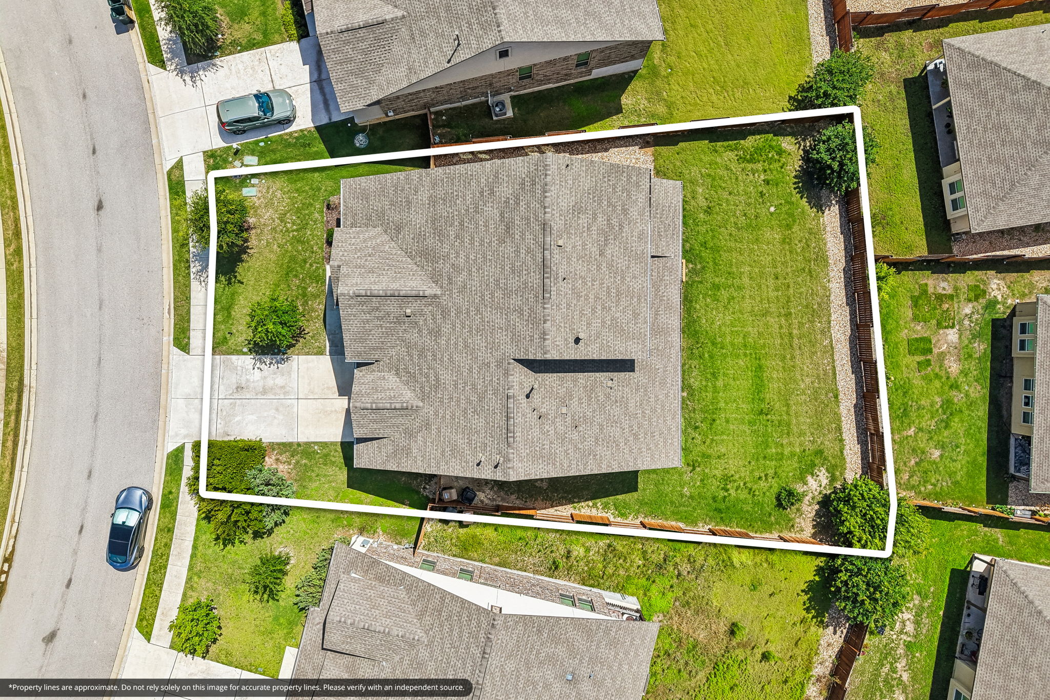 19113 Freeman Circle Austin, TX 78738 - Photo 27 of 37 An aerial perspective showcases a well-maintained property with a verdant lawn and ample outdoor space.