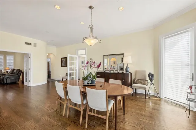 a living room with furniture or wooden floor and a large window