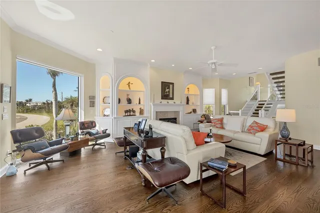 a kitchen with kitchen island granite countertop a stove top oven a sink a counter space and cabinets