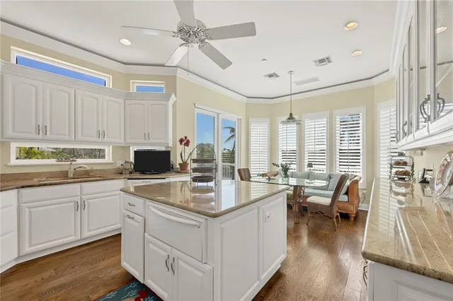 a kitchen island with granite countertop lots of counter top space