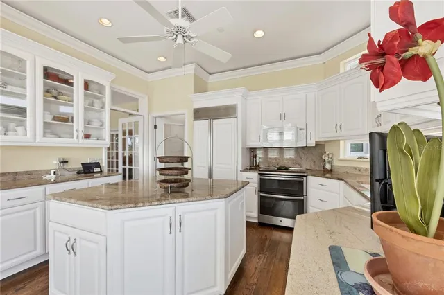 a dining room with furniture and windows