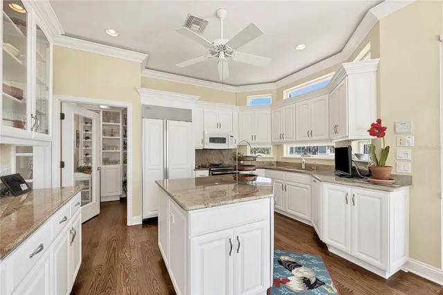 a shelf with books and knick knacks on it