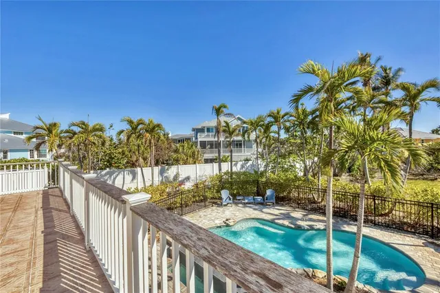 a view of a chair and tables on the roof deck