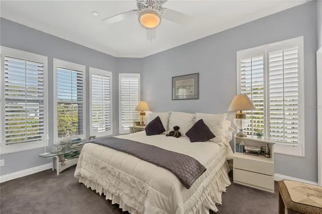 a spacious bedroom with a bed and a couch