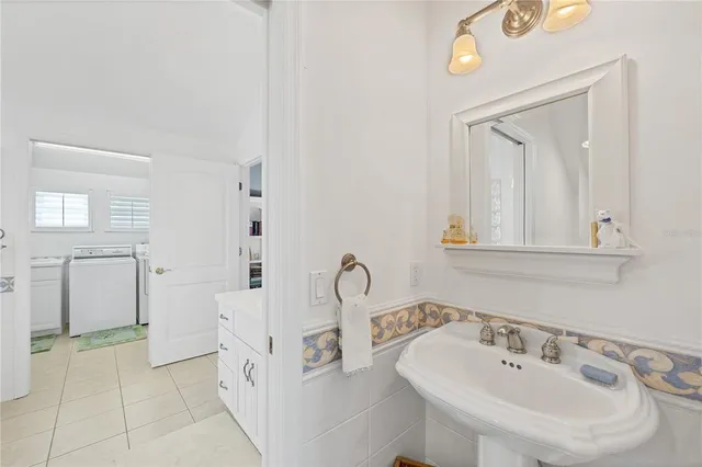 a view of swimming pool with outdoor seating and plants