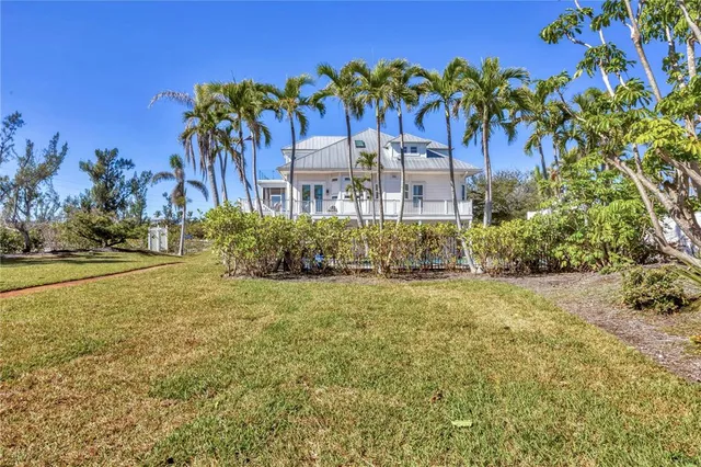 an aerial view of residential building and lake