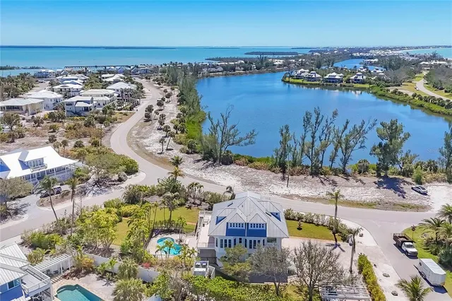 an aerial view of a house with a ocean view