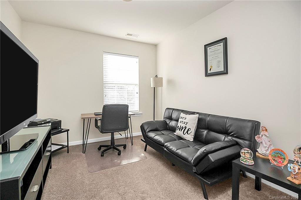 2139 Midnight Blue Lane Fort Mill, SC 29708 - Photo 12 of 23 a living room with furniture and a flat screen tv