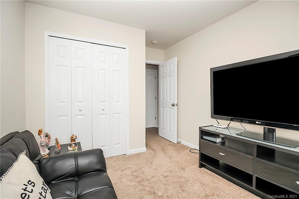 2139 Midnight Blue Lane Fort Mill, SC 29708 - Photo 13 of 23 a living room with furniture and a flat screen tv